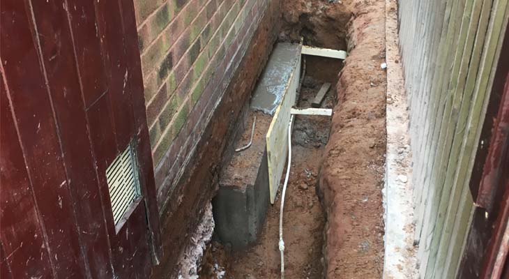 Concrete foundation blocks tied together by steel rods Concrete foundation blocks tied together by steel rods
