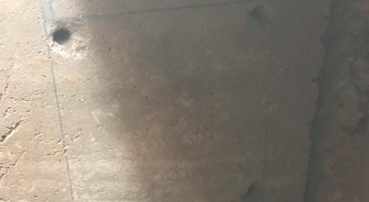 Drilled holes to concrete foundation block Drilled holes to concrete foundation block