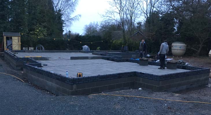 Blue engineering bricks laid onto block and beam sub-floor