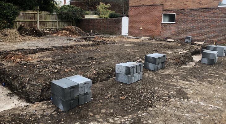 Putting out trench blocks ready for laying.