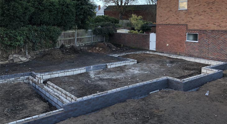 The first few courses of bricks laid.
