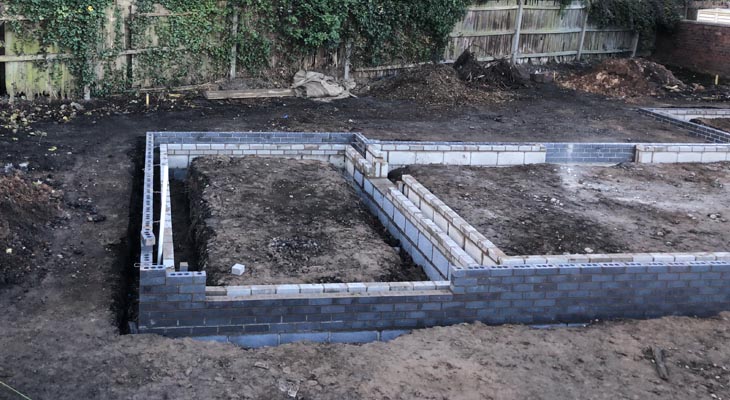 Another view of the first courses of bricks laid.