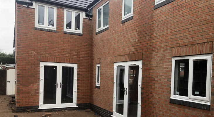 Rear view of completed brickwork with brick on edge sills and soldier courses.