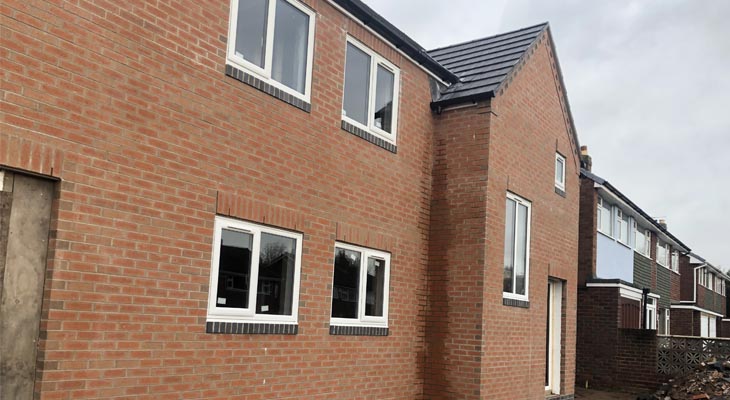 Front view of Pelsall new build with bricklaying complete.